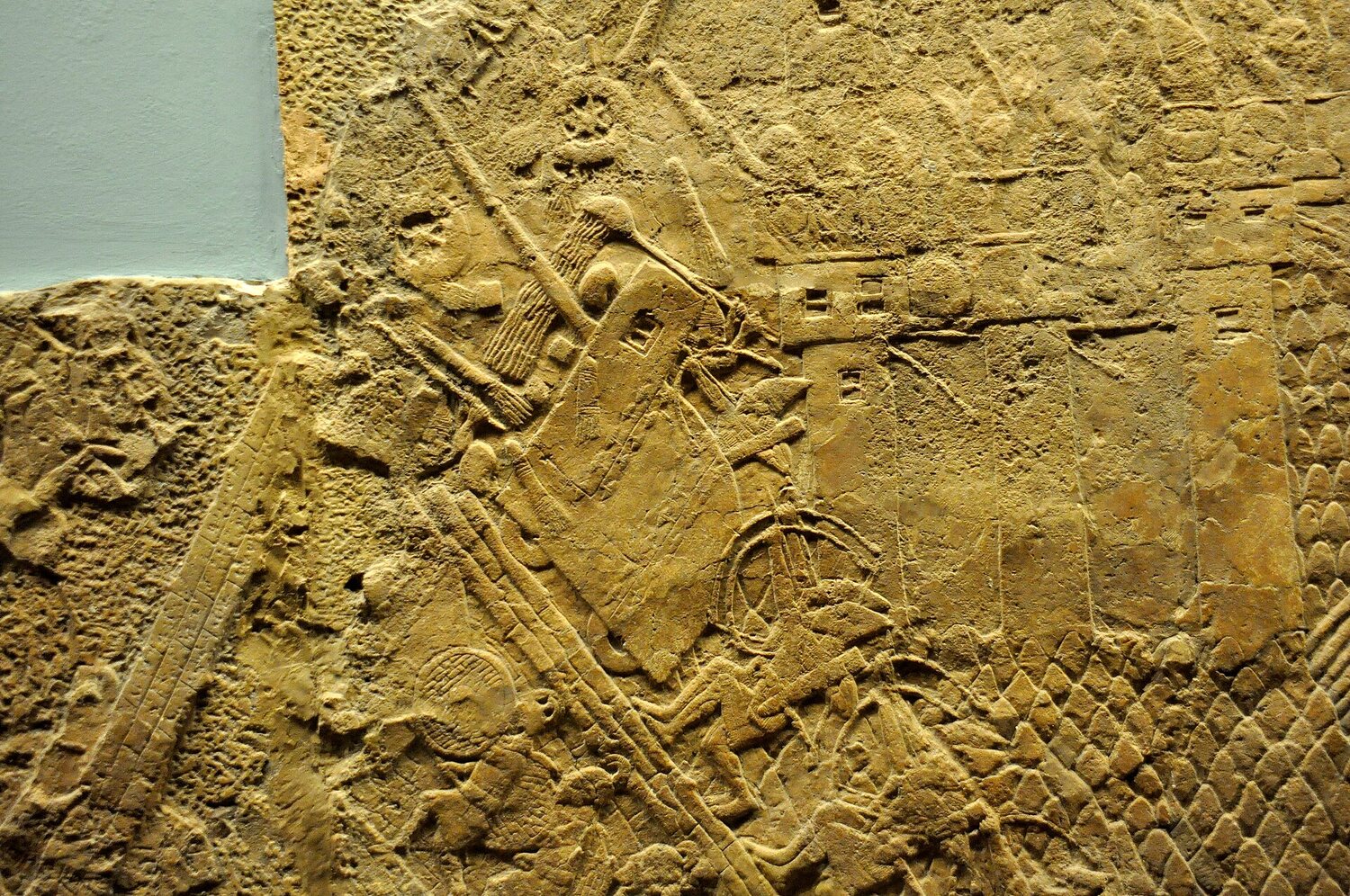 Assyrian relief of a siege-engine attacking the wall of Lachish