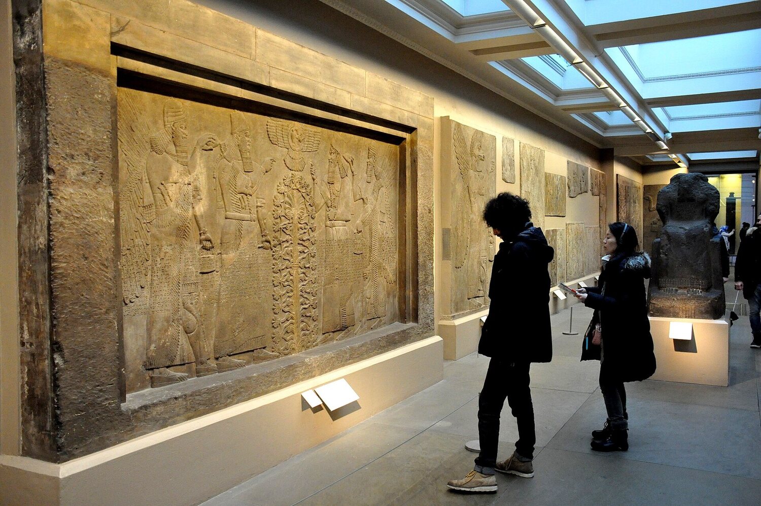 Relief of Ashurnasirpal II and a winged genie flanking the sacred tree, Nimrud