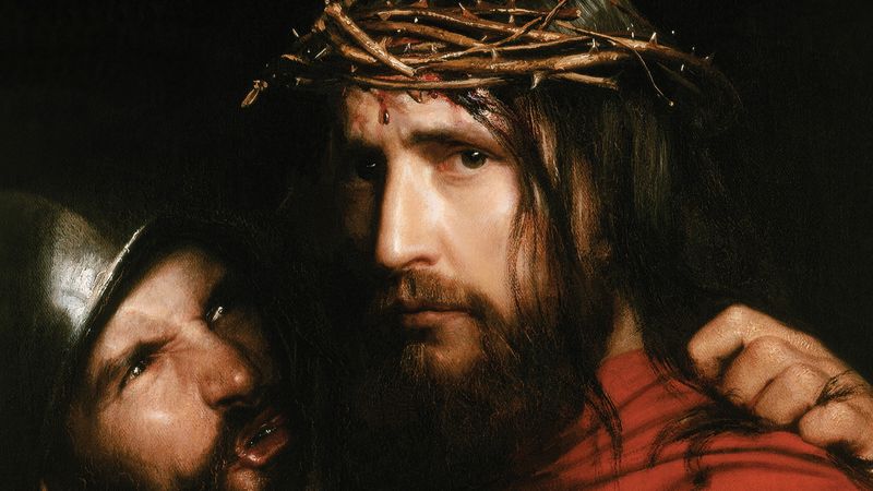 Jesus Christ wearing a crown of thorns beside a soldier.