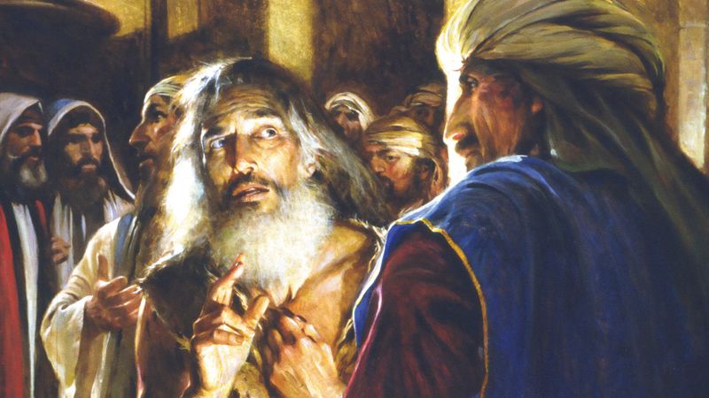 An elderly prophet seized by a crowd of men.
